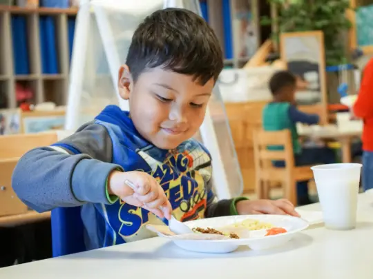 wake-county-child-at-table-scaled