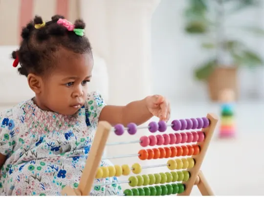 young-black-girl-with-counting-toy-1.jpg