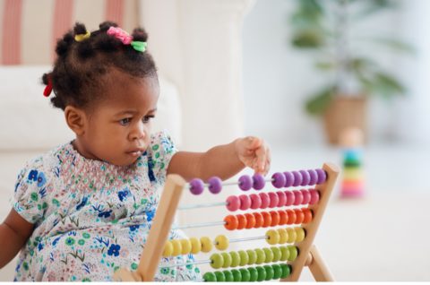 young black girl with counting toy